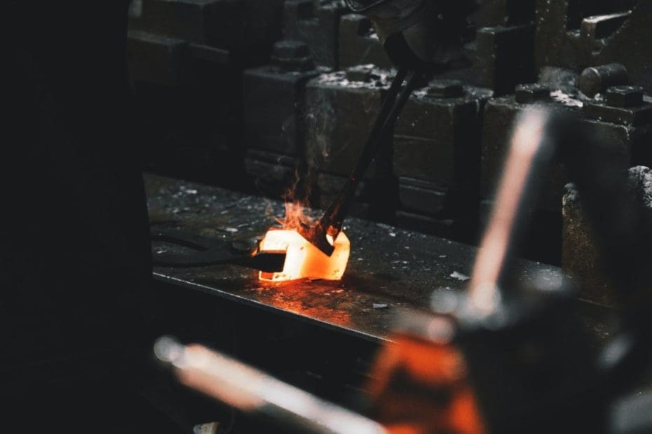 A Metal Worker Repairing Metal Casting Molds