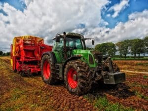 tractor with attached agricultural equipment