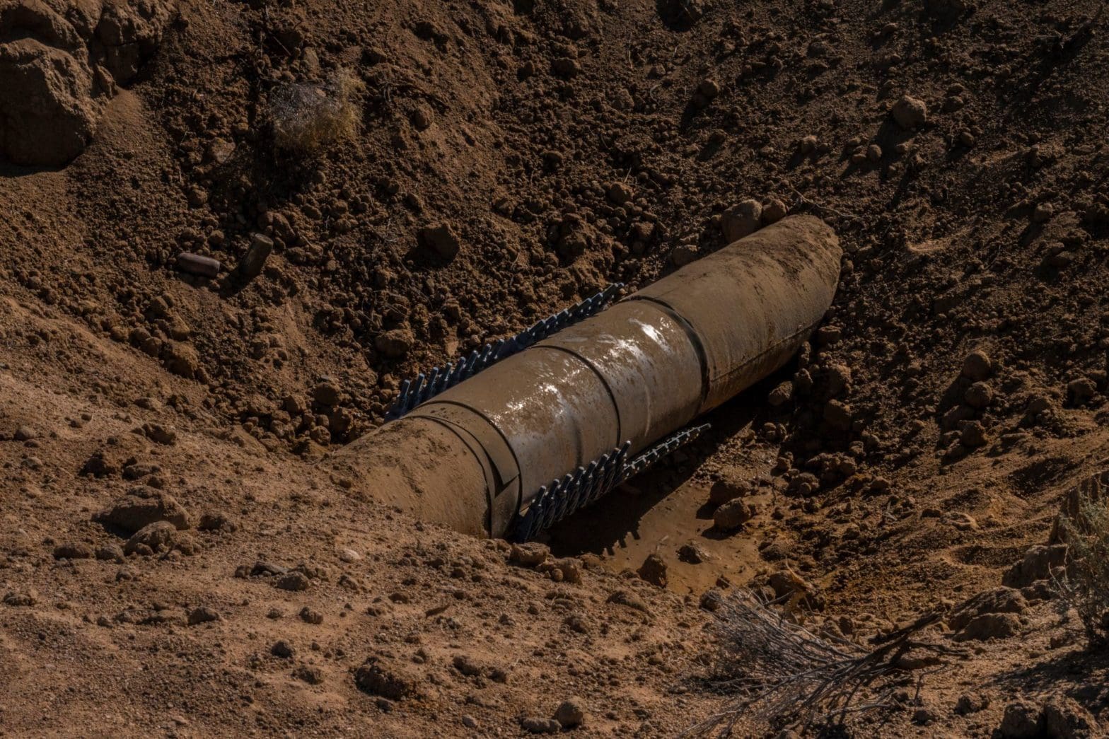 Pipe exposed in the dirt