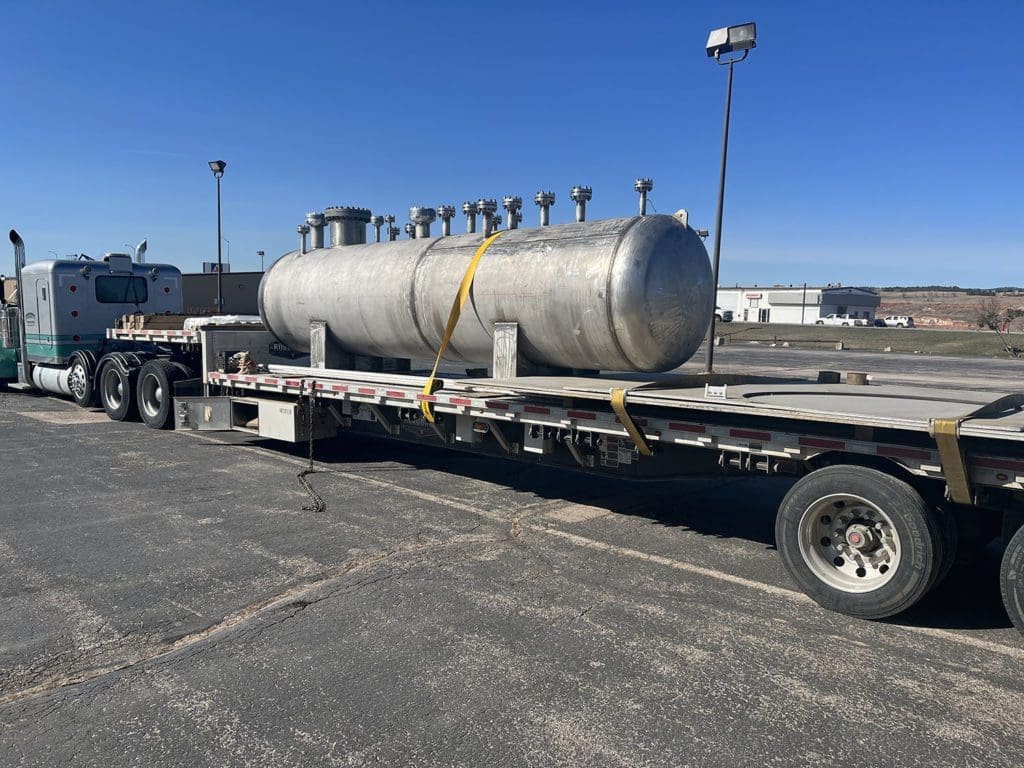 Angled view of a pressure vessel being transported on a trailer