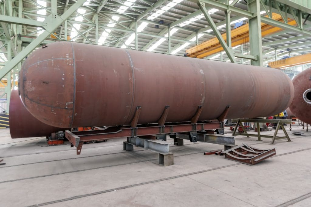 A large red pressure vessel